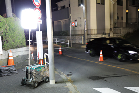 A battery powered light tower illuminates pedestrian pathway. 