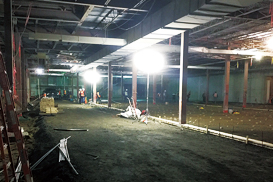 Balloon lights illuminate a construction site.