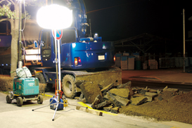 A balloon light illuminates resurfacing job-site. 