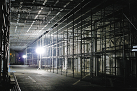 Balloon lights illuminate a building site.